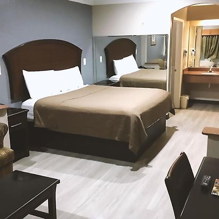 Blue Way Inn & Suites By Jasper Houston Bagian luar foto