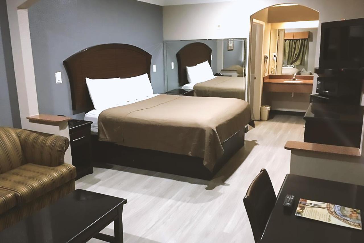 Blue Way Inn & Suites By Jasper Houston Bagian luar foto